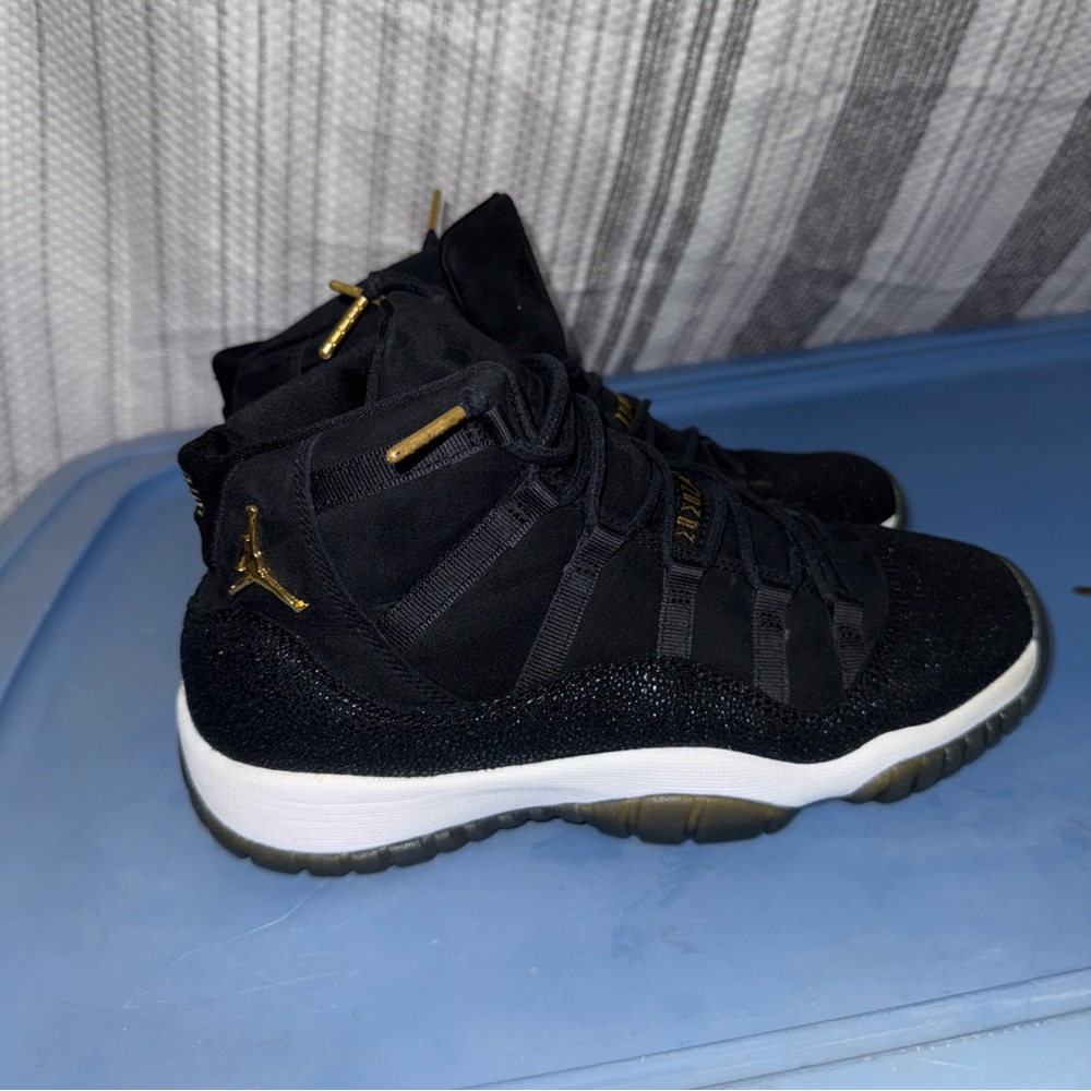 Air Jordan 11 Retro Black Metallic Gold Heiress Sneakers